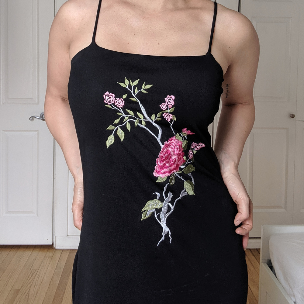 Black evening gown with hand embroidered flower